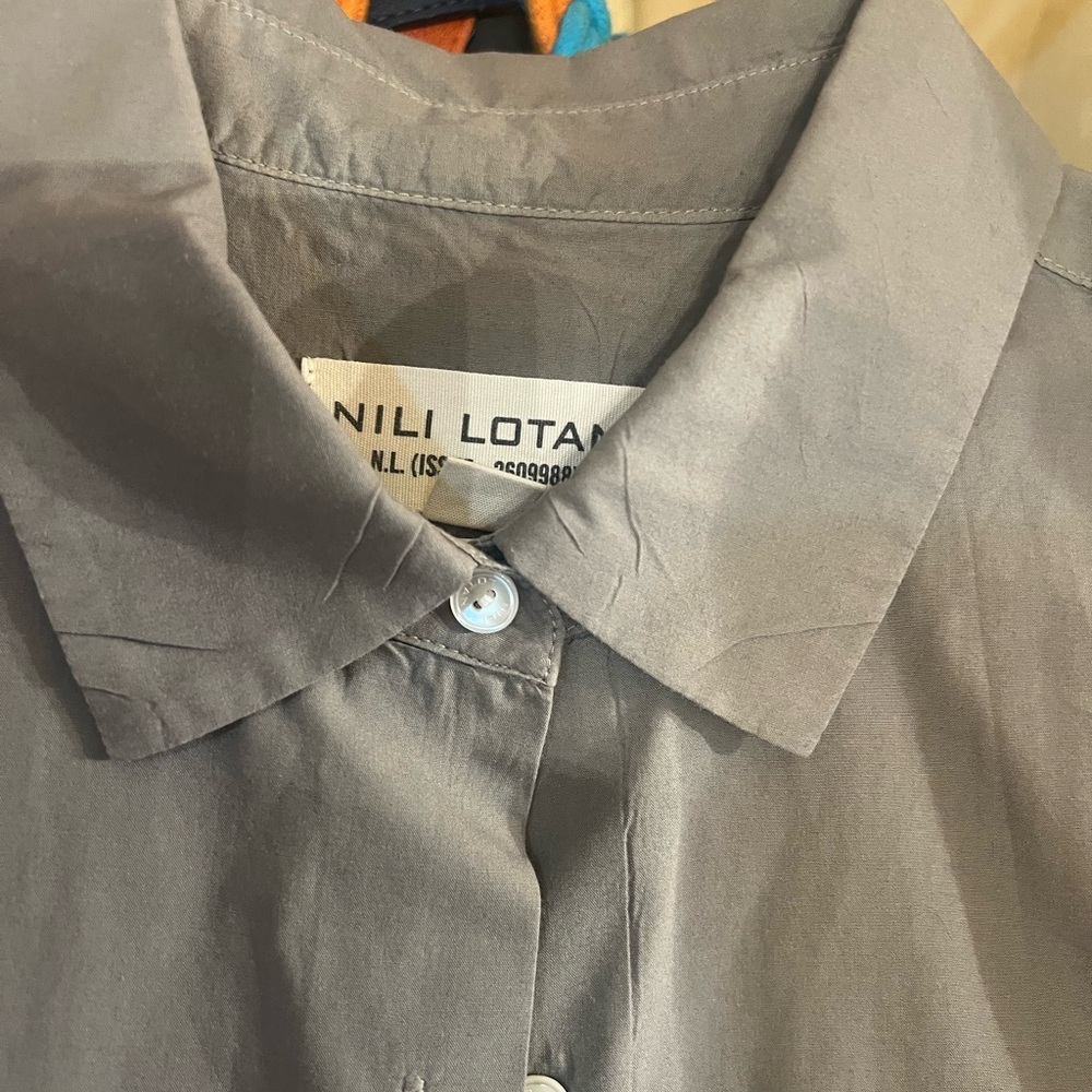 Nili lotan tan shirt lightly used
Small size but fits big